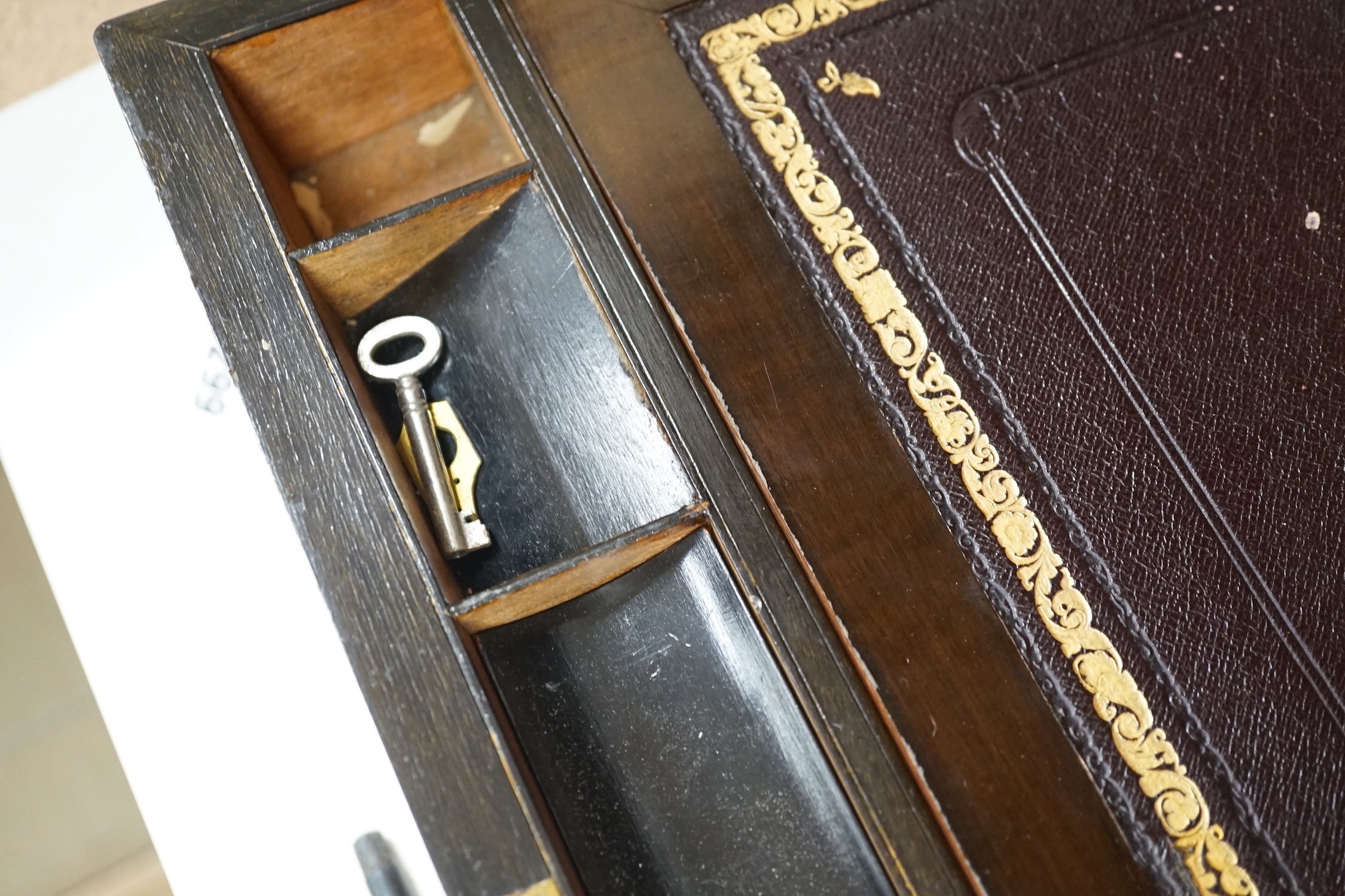 A 19th century mahogany brass bound writing slope, 45.5 cms wide x 18.5 cms high